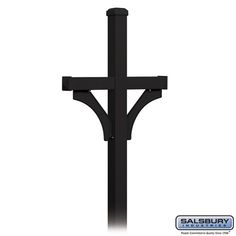 a black metal cross is shown against a white background