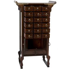 an old wooden cabinet with many drawers and knobs on the front, sitting against a white background