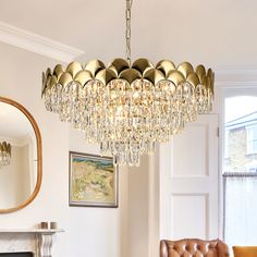 a chandelier hanging from the ceiling in a living room