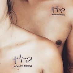 two people with tattoos on their chests, one has a heart and the other has a cross