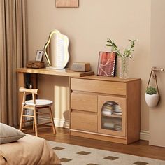 a bed room with a neatly made bed and a wooden desk in front of a window