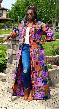 Kimono jacket with pockets made from African prints. Our Ankara duster showcases colorful mixed designs in patchwork patterns, which combine different symbols and images from a variety of African fabrics.  Everything in our shop will be handmade for you in your measurements, so simple adjustments can be accommodated at no additional cost.  Upon ordering,  please send your height or preferred length while ordering. *Matching headwrap or waist tie available per customer request. Our items can be c African Print Kimono, Ankara Kimono, Kimono Outfits, Patchwork Kimono, Plus Size Kimono, Mode Kimono, Long Duster, Kimono Robes, African Fabrics