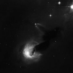 an image of a black and white photo of a star in the sky with stars