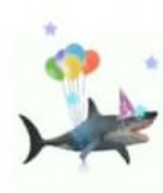 a shark with party hats and balloons floating in the air