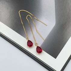 Ruby Red Thread Teardrop Earrings, Cerise Bright Red Crystal Earrings, Statement Earrings, Long Ruby Earrings, Ruby Red Thread Earrings. These are simple and beautiful ruby red teardrop crystal earrings. Bright red crystals are framed in bright gold and dangling from long thread. Measurements: The total length from the top of the hook to bottom - 3.34 inches (85 mm) approximately. Crystals: 10 mm x 6 mm The earrings would be a PERFECT GIFT for you and your family and friends! Click here to see m Classy Earrings, Earrings Dangling, Red Mirror, Red Thread, Thread Earrings, Ruby Earrings, Earrings Long, Red Crystals, Earrings Statement