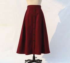 " *Pleated skirt *Length approx: 90cm *There is a zipper on the side *Wash by hand or machine with cold water *The Skirt is made of wool. If you want other colors on the color card, please leave the color card number when you place your order. Auailable in women's us size XXS to 3XL as well as custom size and plus size  XXS: Waist:66cm/26\" Length:90cm/35.5\" XS: Waist:70cm/27.5\" Length:90cm/35.5\" S: Waist:74cm/29\" Length:90cm/35.5\" M: Waist:78cm/30.5\" Length:90cm/35.5\" L: Waist:82cm/32\" Red Winter Skirt, Button Skirt Outfit, Warm Skirt, Long Wool Skirt, Red Long Skirt, Warm Skirts, Long Linen Skirt, Maroon Skirt, Handmade Skirts