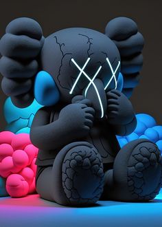 a black teddy bear with a neon mask sitting on the ground