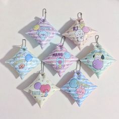 six ornament shaped like animals hanging from strings