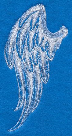 an embroidered angel wing on a blue t - shirt with white threadwork in the middle