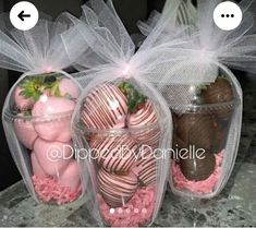 three plastic containers filled with chocolate covered strawberries and strawberries wrapped in tulle