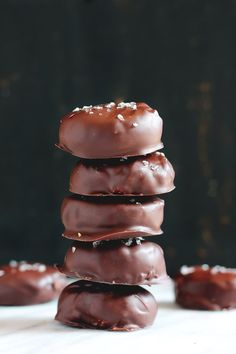 chocolate covered donuts stacked on top of each other