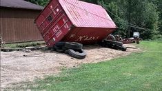 there is a red trailer that has been pulled over on the side of the road