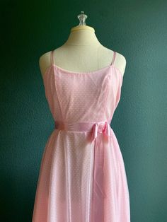 "This is the Barbie Dream Dress you have been looking for. 1960's  Vintage dress made by Dance Allure in Pink Swiss Dot fabric in the most Barbie Pink Color.  Spaghetti  Straps  Satin Bow at waist  Side zip closure  Floor Length Measurements laying flat: 17\" at bust  12.5 inches at high waist  open hip  from shoulder strap to hem 60\"" Pink Daywear Dresses With Bow, Retro Spring Dresses With Bow, 1950s Style Pink Daywear Dresses, Barbie Pink Color, Vintage Fashion 1960s, Swiss Dot Fabric, 1960 Dress, Fashion 1960s, Pink Gown