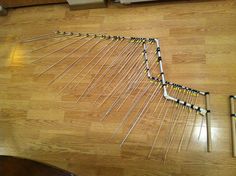 an overhead view of a wooden floor with many wires attached to it