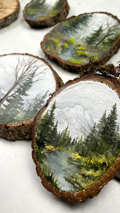 several pieces of wood with trees painted on them