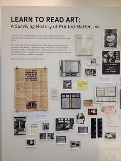 a wall with pictures and papers on it that says learn to read art a surviving history of printed matter, inc