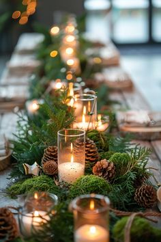 a long table with pine cones and candles