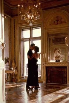 a man and woman dancing in an ornate room