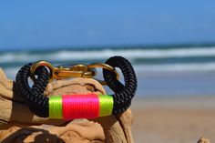 a close up of a dog toy on the beach