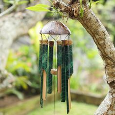 a wind chime hanging from a tree branch