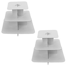 two white tables sitting on top of each other in the shape of an upside down table