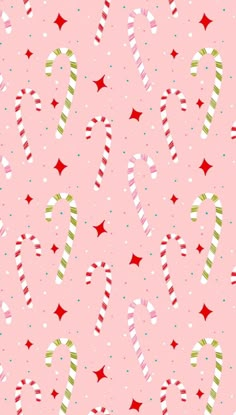 candy canes and stars on a pink background