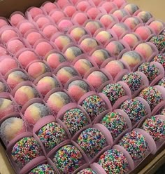 a box filled with lots of colorful sprinkles on top of each other