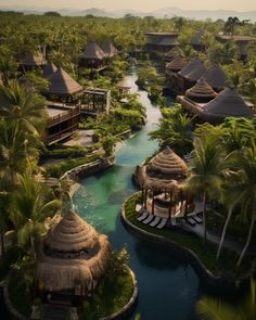 an aerial view of the resort and surrounding water features palm trees, thatched huts, and pool