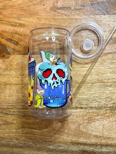 a glass with an image of a cartoon character on the side and a handle attached to it