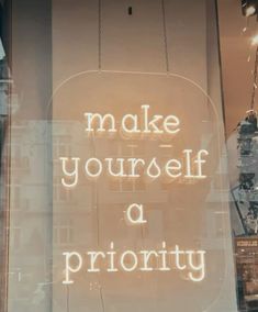 there is a sign that says make yourself priority on the front window of a store