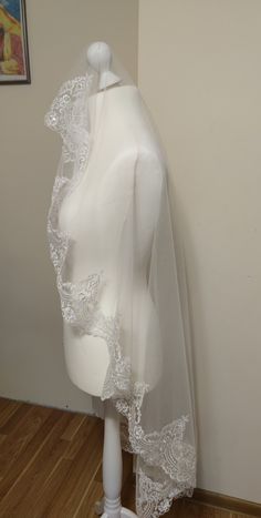 a mannequin with a veil on top of it