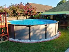 an above ground swimming pool in a backyard