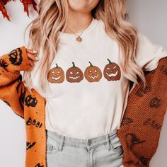 Pumpkins Halloween Shirt Explore Our Latest Collection Of Gildan 5000 T-Shirts, Combining Style, Versatility, And Exceptional Comfort! These T-Shirts Are Available In Sizes S To 3xl And Come In A Variety Of Vibrant Colors, Including Black, White, Sand, Green, Sport Grey, Red, Navy, And More. Made From Premium Materials, They Offer A Soft, Luxurious Feel And All-Day Comfort. Designed To Be Durable, They Maintain Their Shape And Color Even After Frequent Wear And Washing. Enjoy Fast And Reliable D Spirit Week Outfits, Halloween Clothes, Stay Spooky, Shirt Stays, Neck Collar, Peta, Halloween Tshirts, Spooky Season, Halloween Shirt