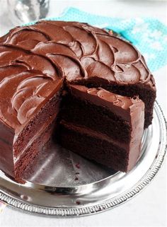 a chocolate cake with one slice missing from it