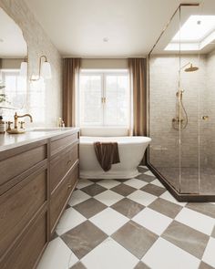 a bathroom with a checkered tile floor and white bathtub next to a walk in shower