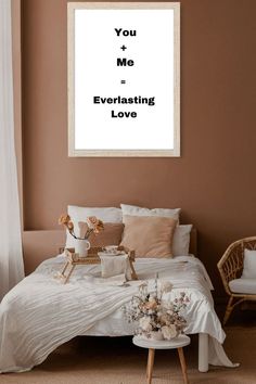 a bedroom with a bed, chair and framed quote on the wall above it that says i'm not good at anything except everything except having you