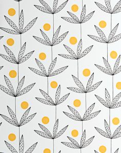 a white wall with yellow dots and leaves on it