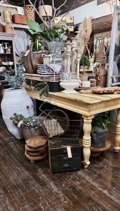 a room filled with lots of different types of furniture and decor on top of wooden floors