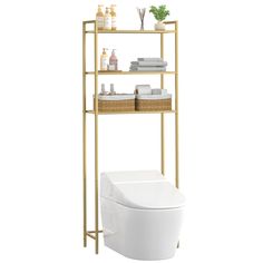 a gold shelf over a toilet with towels and soaps on the shelves next to it