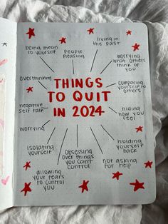 an open notebook with writing on it that says things to quit in 2014 and red stars