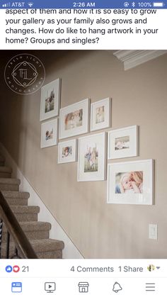 a staircase with pictures on the wall above it