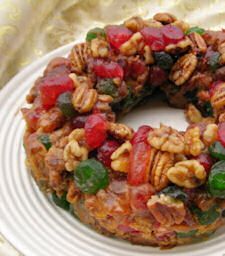 a fruit and nut cake on a white plate