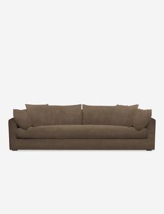 a brown couch sitting on top of a white floor