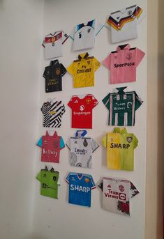 there are many different shirts hanging on the wall