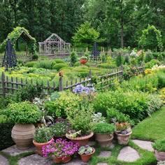 a garden filled with lots of plants and flowers