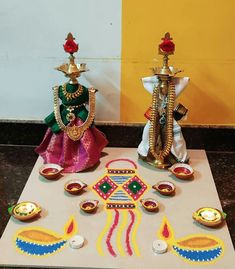 two decorative items are sitting on a table