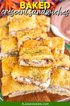 baked crescent sandwiches on a wooden cutting board with carrots in the background and text overlay