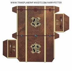 the harry potter book is opened to reveal its contents and features hogwart's crests