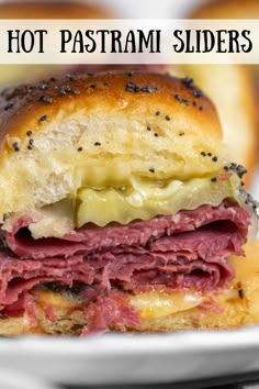 a close up of a sandwich on a plate with the words hot pastrami sliders