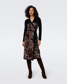 Crafted from knit jacquard, the Savannah wrap dress has a soft, textured feel. This piece has long sleeves, a V-neckline, and true wrap closure. Contrasting solid detail features on the shoulders and tie at the waist.Eloisa is 5 Foot and 8 Inches and wearing a size XS. Black Wrap Dress With Surplice Neckline For Fall, Black Wrap Dress For Fall, Black Long Sleeve Wrap Dress For Fall, Wrap Dress Dvf, Dvf Wrap Dress, Wrap Sweater Dress, Knit Wrap Dress, Maxi Jersey Dress, Savannah